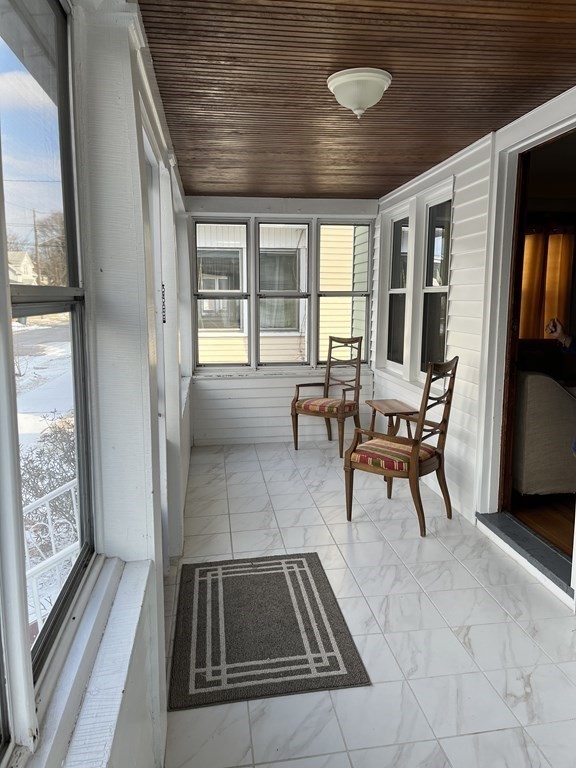 111 Wilber Street Springfield, MA 01104 - Photo 3 of 26 a living room with furniture and a floor to ceiling window