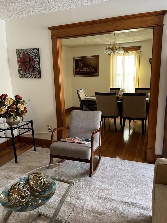 111 Wilber Street Springfield, MA 01104 - Photo 6 of 26 a living room with furniture and a mirror