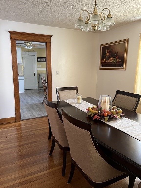 111 Wilber Street Springfield, MA 01104 - Photo 8 of 26 a room with a table chairs and wooden floor