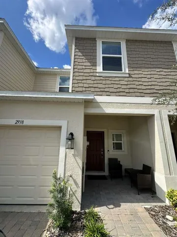 a potted plant sitting in front of a house