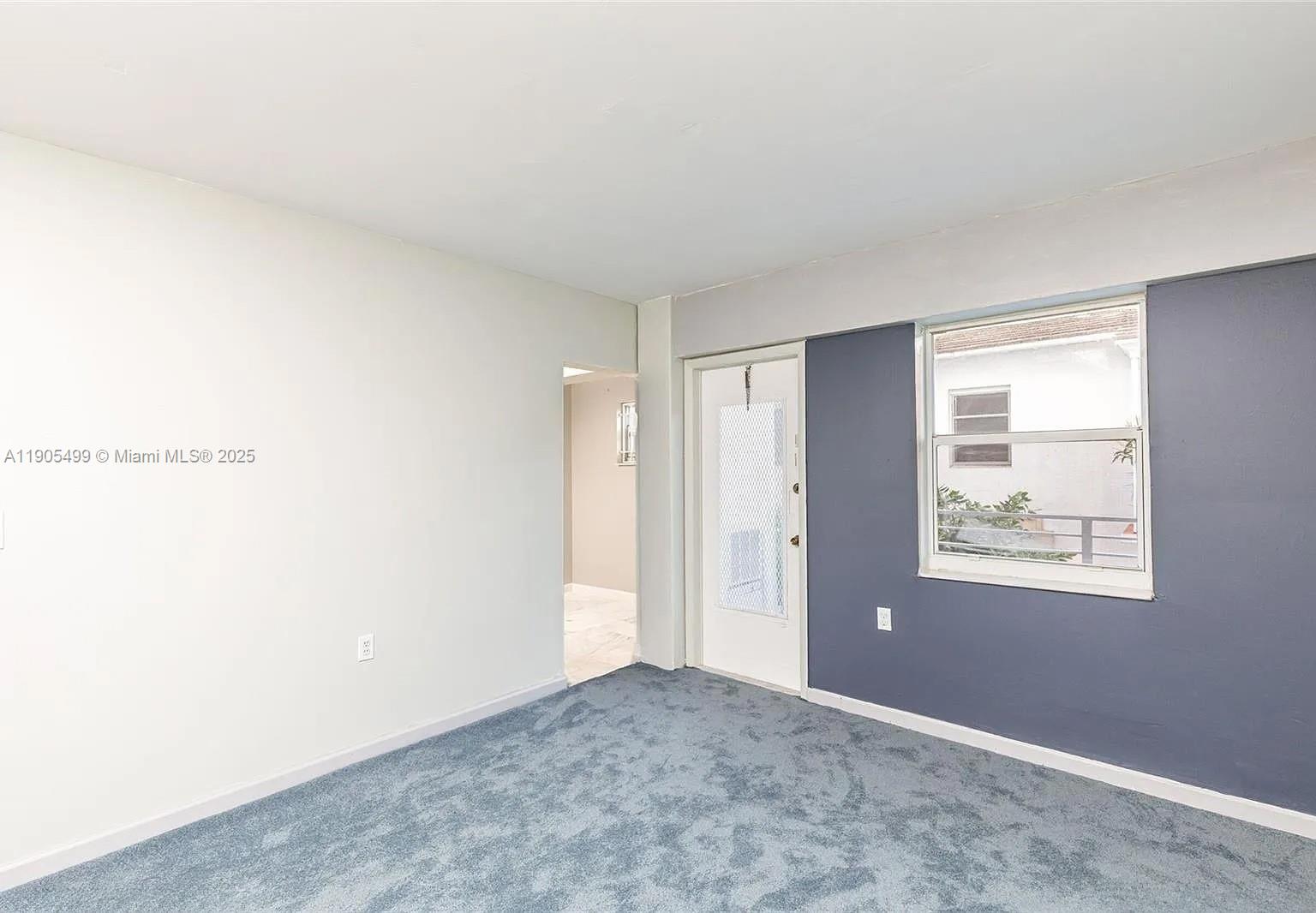 1545 Euclid Avenue, Unit 2D Miami Beach, FL 33139 - Photo 11 of 23 a view of an empty room and window