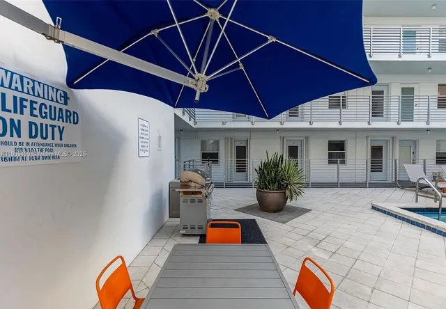 a backyard of a house with seating space