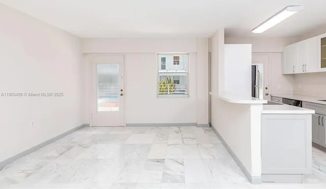 a view of a kitchen with a sink