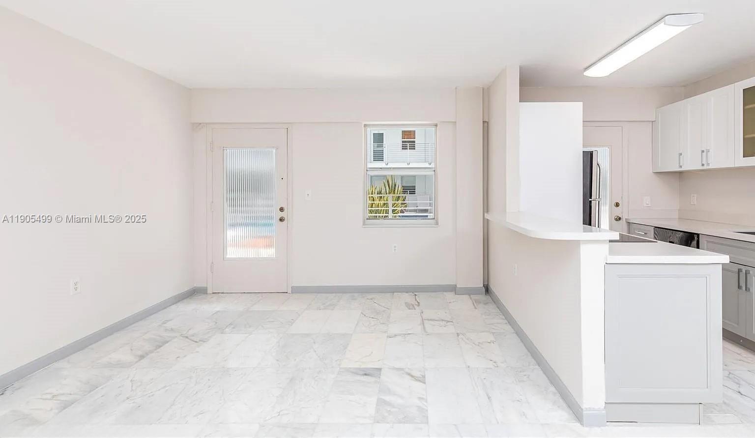 1545 Euclid Avenue, Unit 2D Miami Beach, FL 33139 - Photo 18 of 23 a view of a kitchen with a sink
