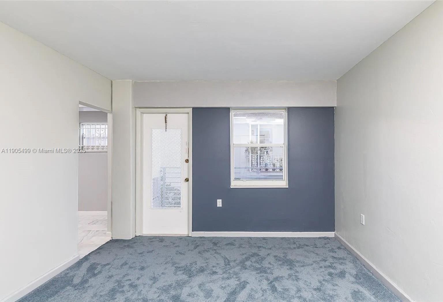 1545 Euclid Avenue, Unit 2D Miami Beach, FL 33139 - Photo 20 of 23 a view of an empty room with window and closet area