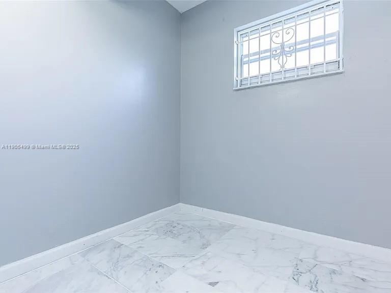 1545 Euclid Avenue, Unit 2D Miami Beach, FL 33139 - Photo 5 of 23 an empty room with windows
