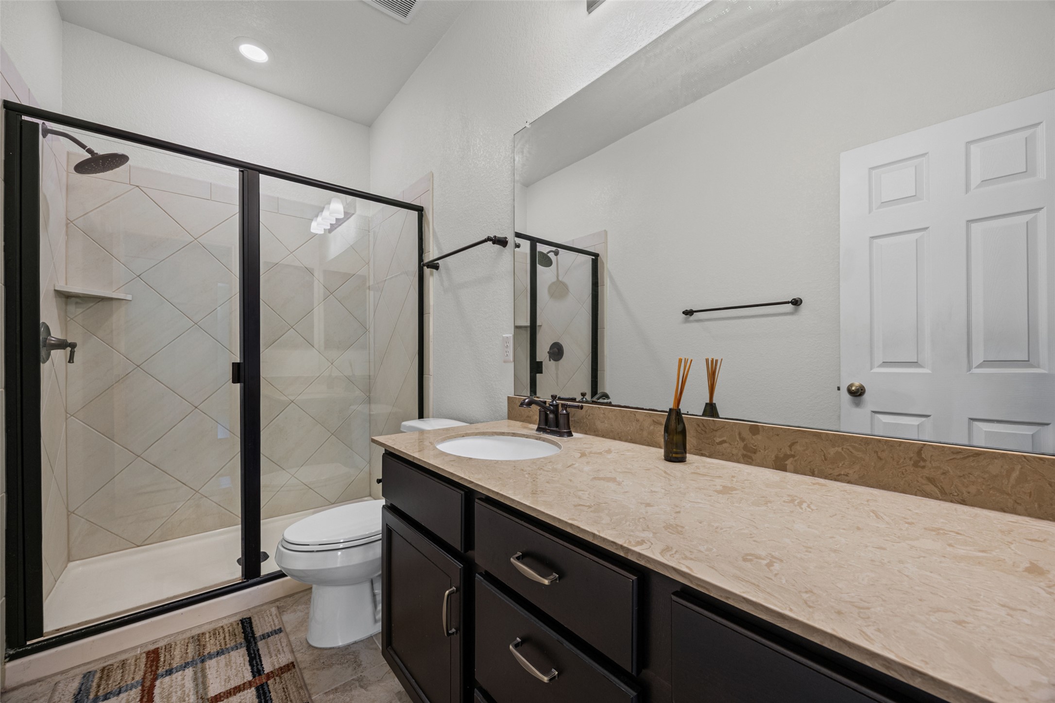 2471 Sunrise Road, Unit 64 Round Rock, TX 78664 - Photo 18 of 32 A well-appointed bathroom features a spacious shower and ample counter space.