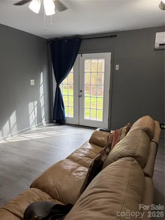 a bed sitting in a bedroom next to a window