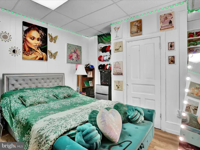 a living room with furniture and baby bed