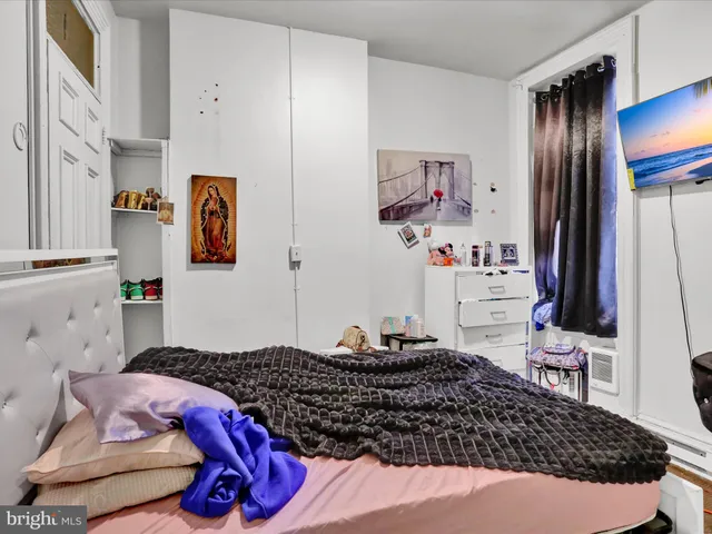 a bedroom with a bed and furniture