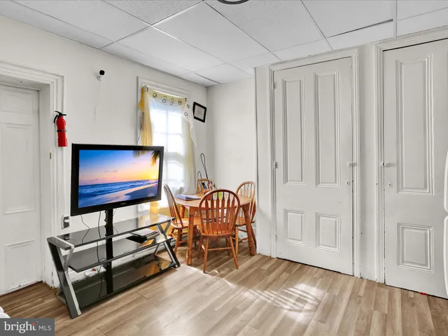 a view of a livingroom with furniture and a window