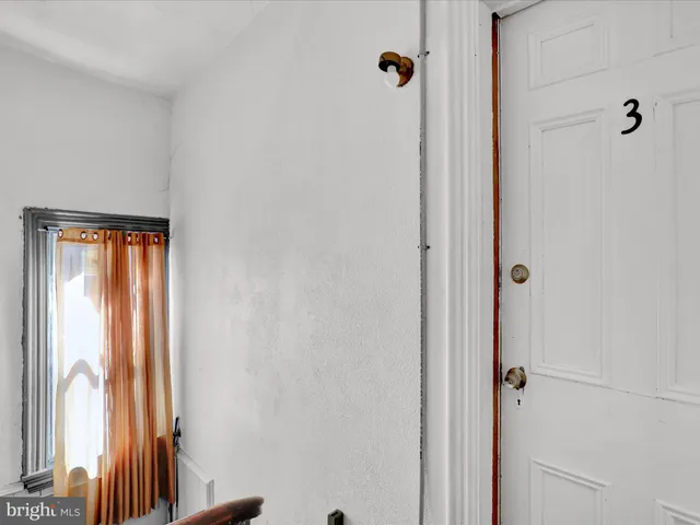 a bathroom with a shower and a window