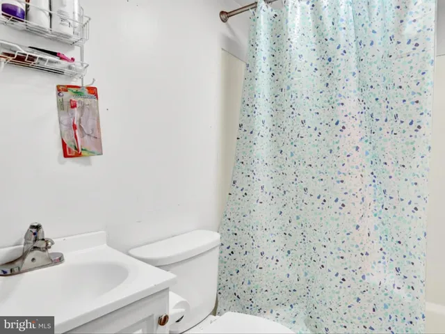 a bathroom with a toilet and a sink