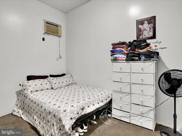 a bedroom with a bed and cabinets