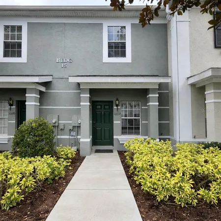 a kitchen with cabinets stainless steel appliances and a sink