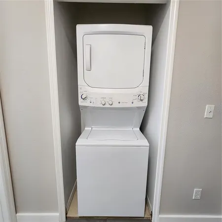 a view of an empty room and wooden floor