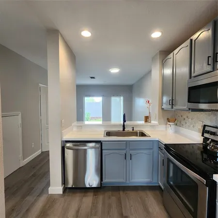 a view of kitchen with wooden floor