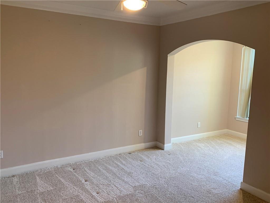 7701 Rialto Boulevard, Unit 1222 Austin, TX 78735 - Photo 4 of 14 An inviting interior with soft carpet and crown molding, ready for personal touches.