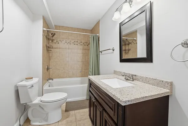 a view of a hallway with wooden floor and entryway