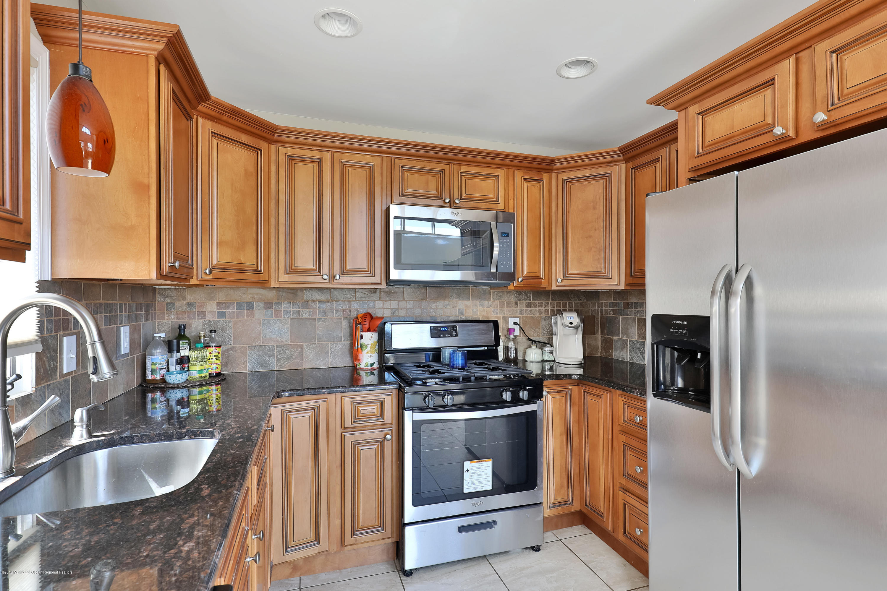 41 Club House Road Brick, NJ 08723 - Photo 12 of 33 a kitchen with stainless steel appliances granite countertop a refrigerator stove and sink
