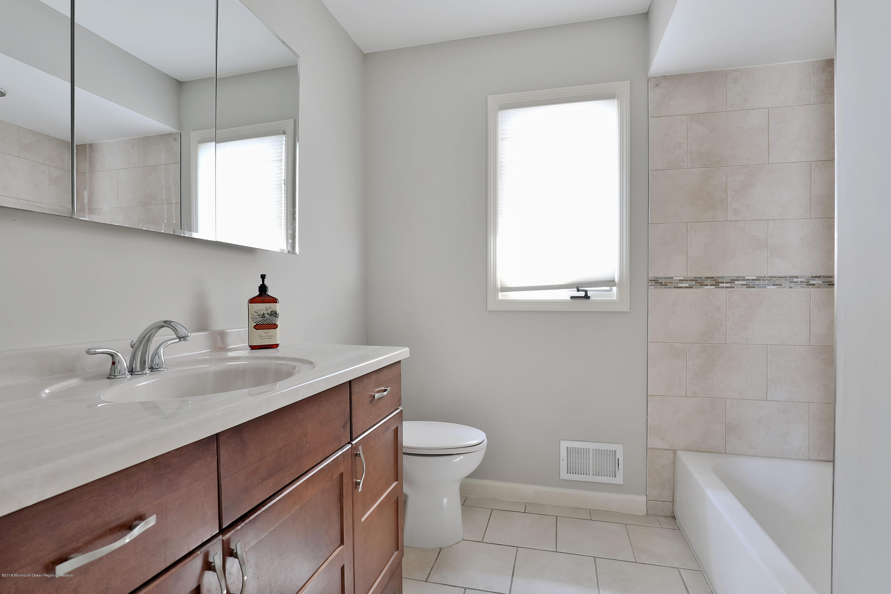 41 Club House Road Brick, NJ 08723 - Photo 20 of 33 a bathroom with a sink toilet vanity and tub