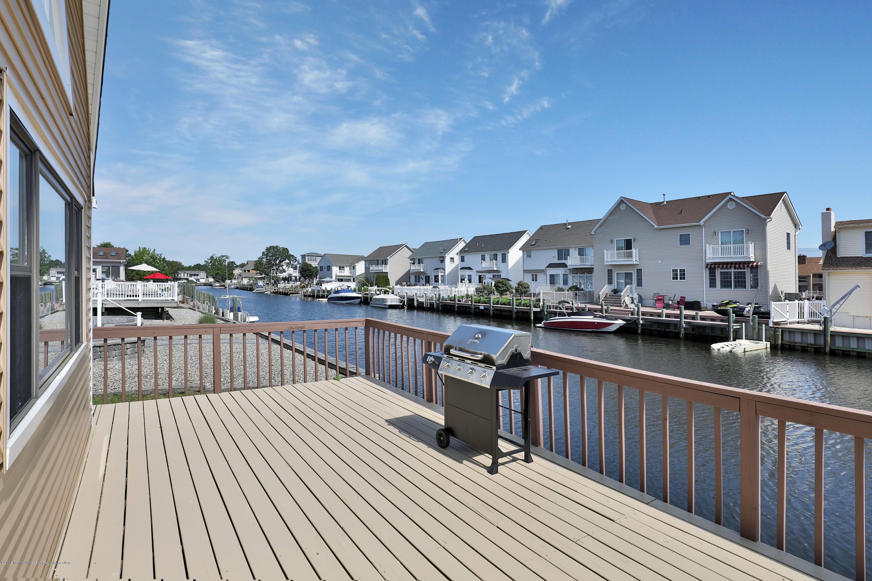 41 Club House Road Brick, NJ 08723 - Photo 21 of 33 a view of a balcony with wooden floor and city view