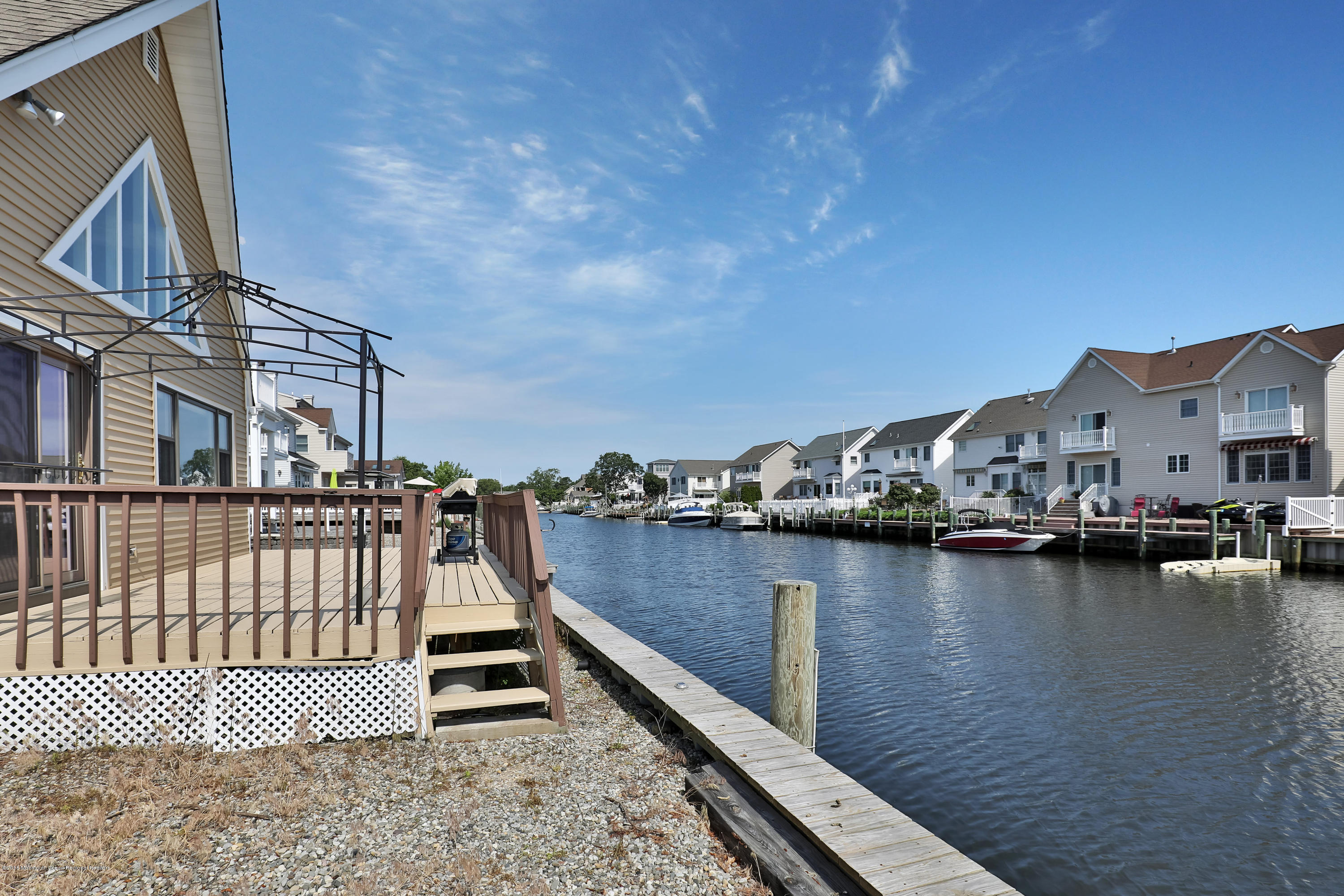 41 Club House Road Brick, NJ 08723 - Photo 23 of 33 a view of roof deck with two couches and wooden floor