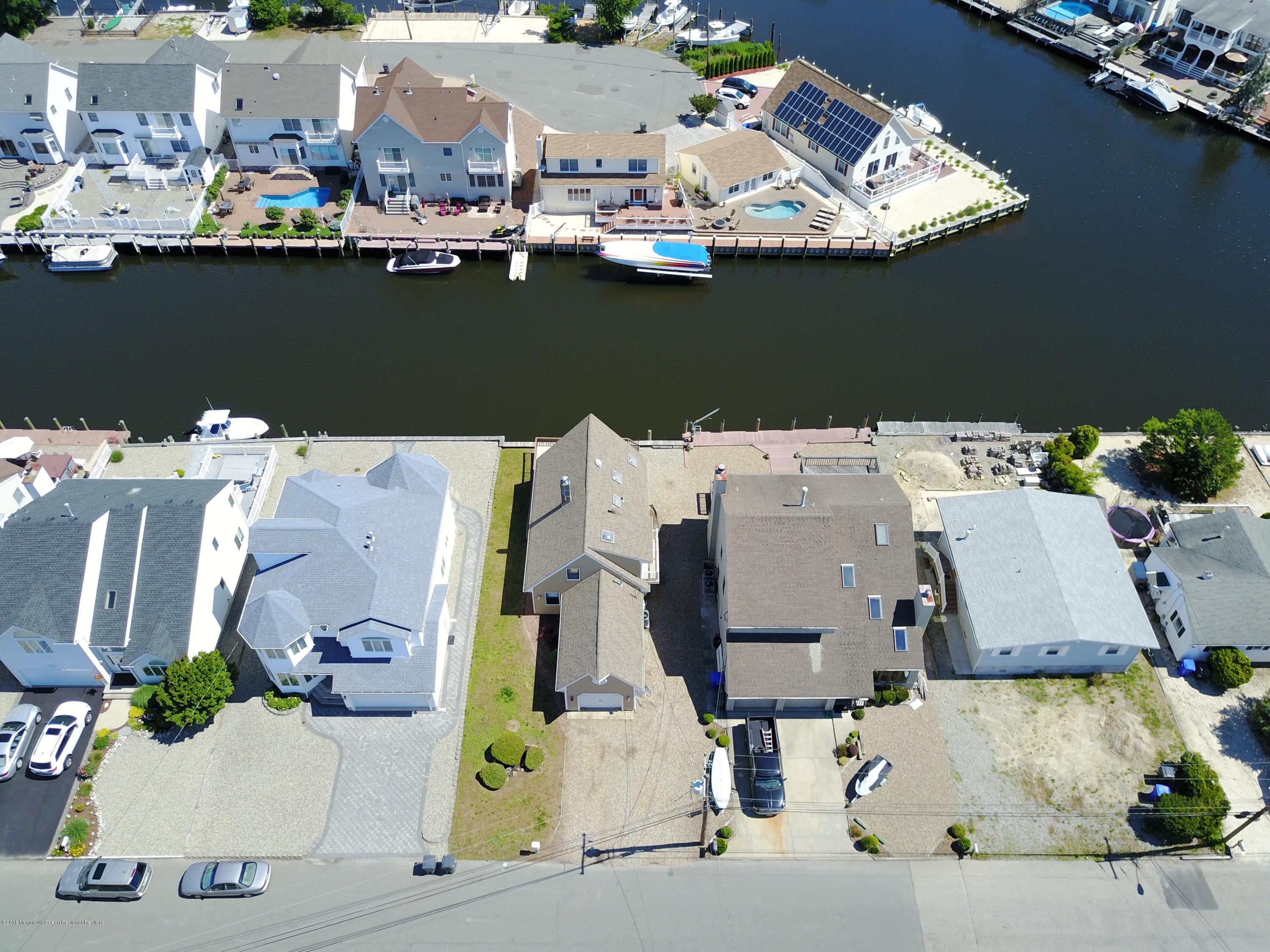 41 Club House Road Brick, NJ 08723 - Photo 3 of 33 an aerial view of residential houses with outdoor space