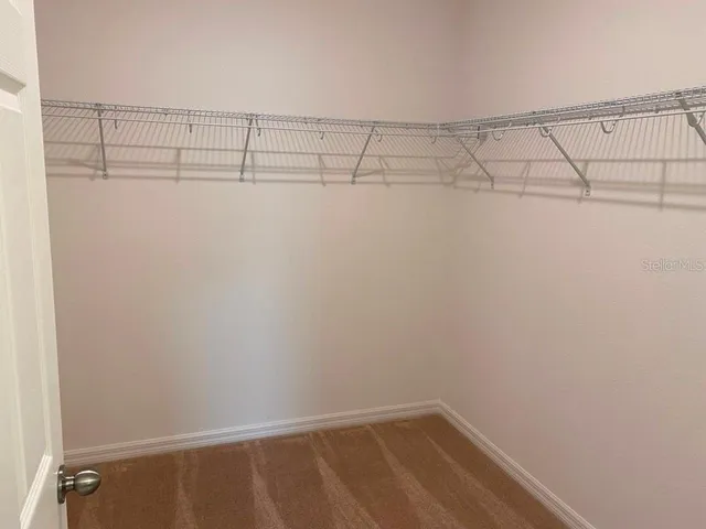 a view of a room with racks on the wall