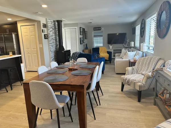 a bedroom with a bed and a computer on a table