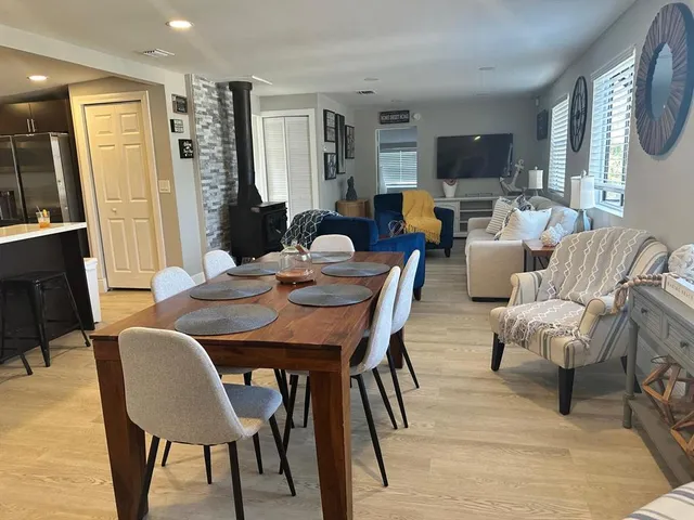 a bedroom with a bed and a computer on a table