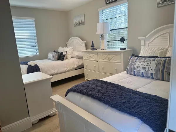 a bedroom with a bed and balcony