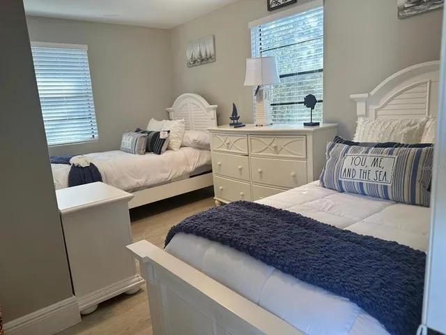 a bedroom with a bed and balcony