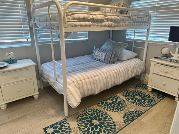 a bedroom with a bed and a dresser