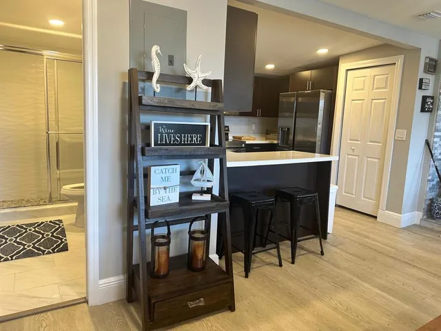 a dining room with furniture and wooden floor