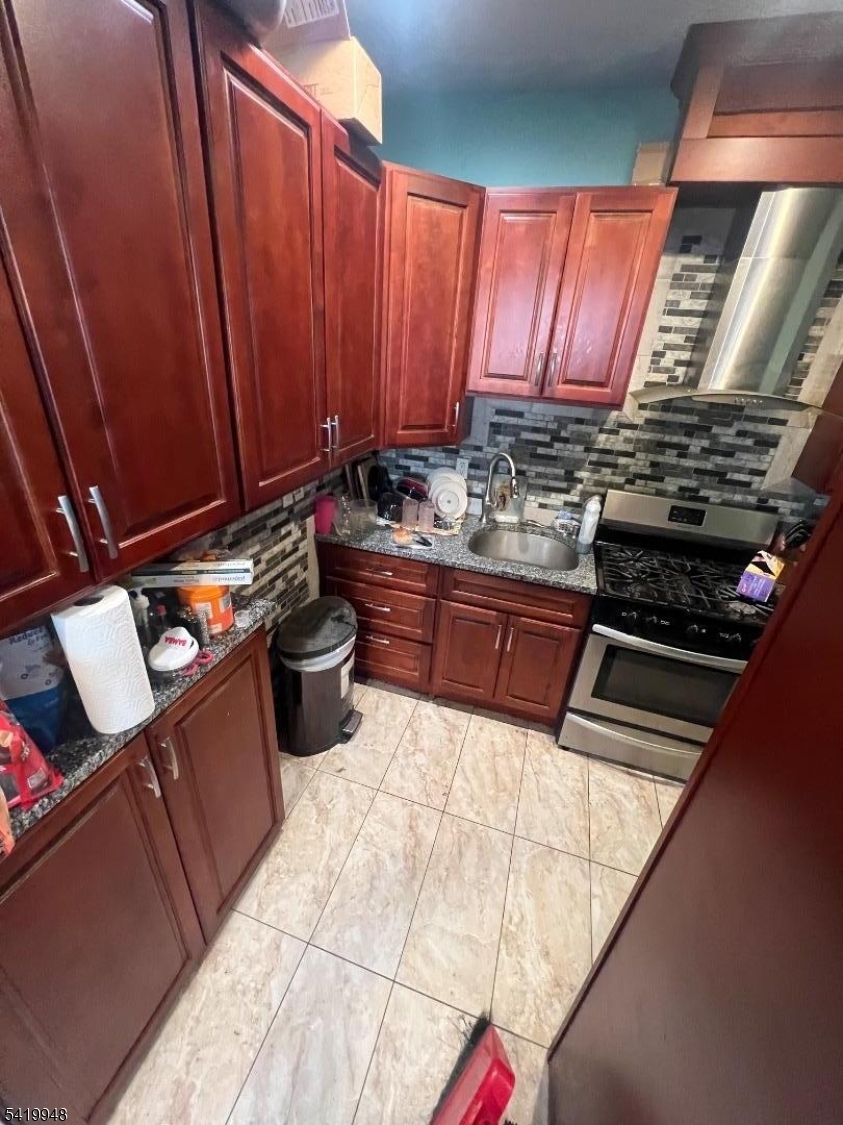 32 Augusta Street Irvington, NJ 07111 - Photo 5 of 10 a kitchen with table and chairs