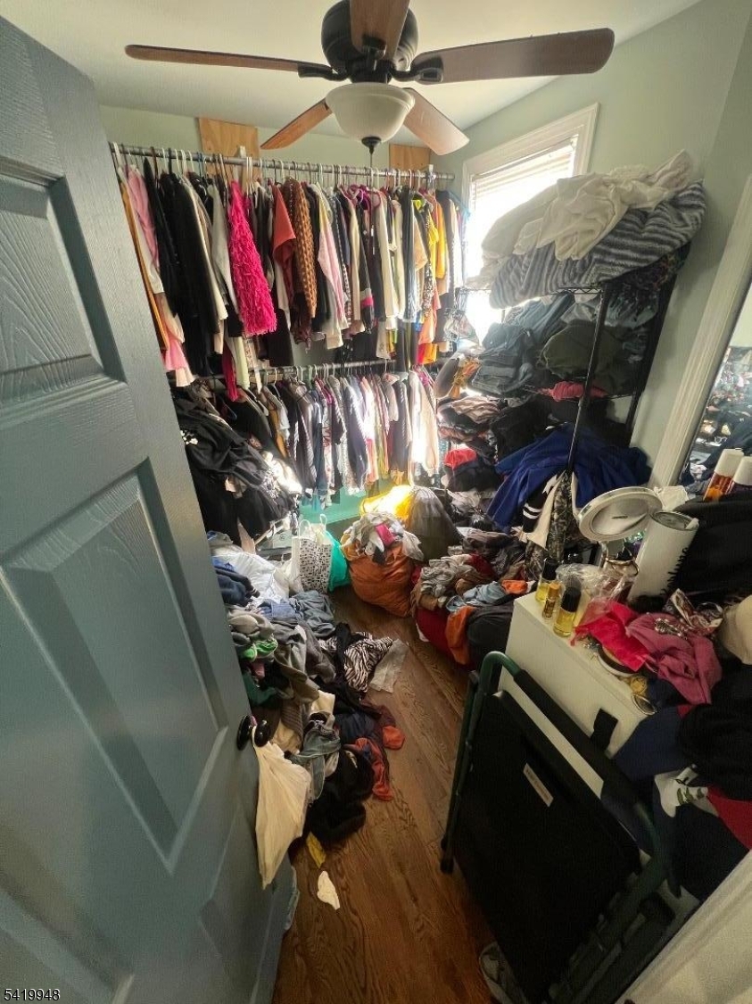 32 Augusta Street Irvington, NJ 07111 - Photo 7 of 10 a view of walk in closet with clothes and shoes