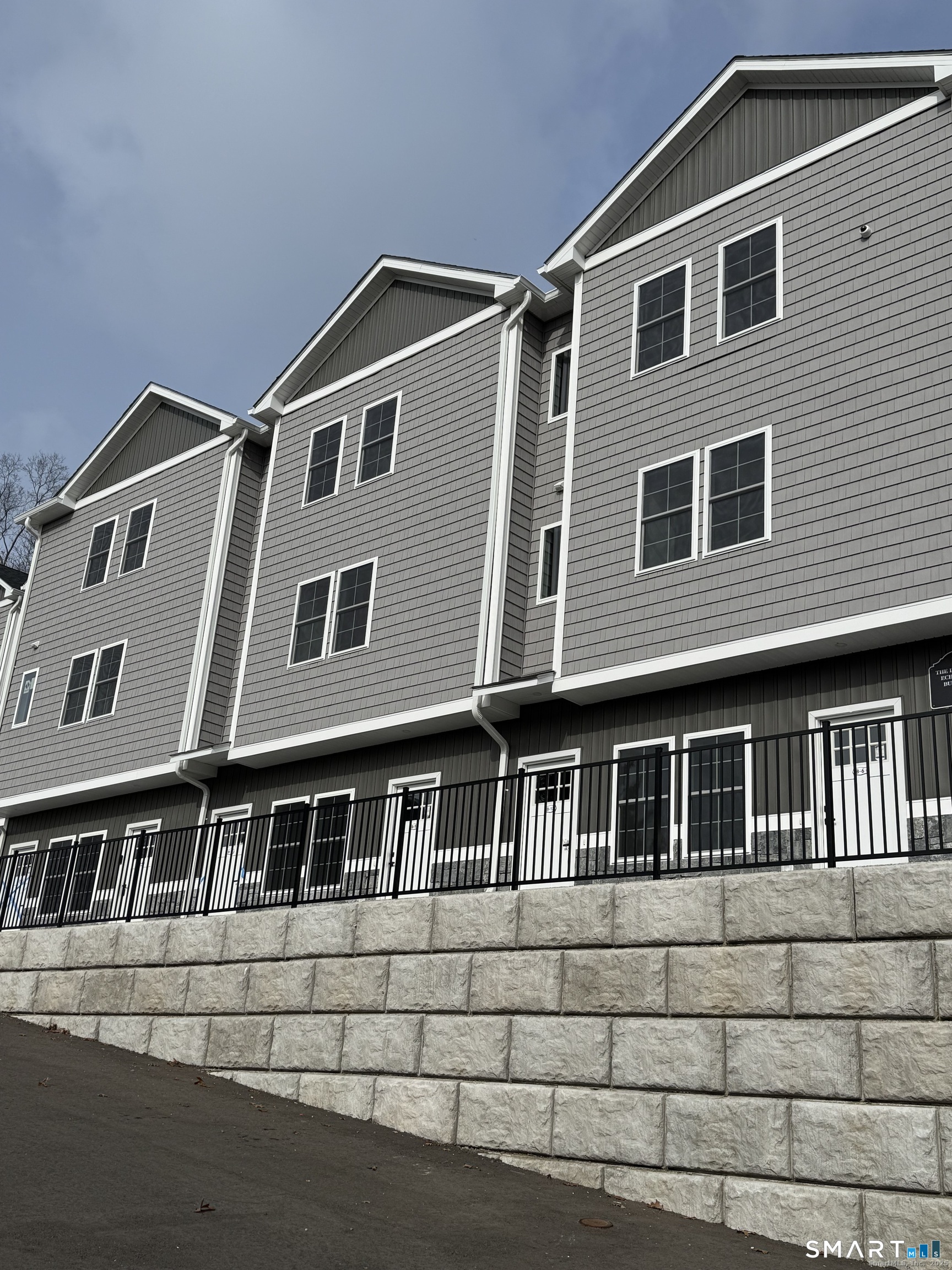243 Echo Lake Road, Unit B12 Watertown, CT 06795 - Photo 4 of 11 a front view of a house with windows