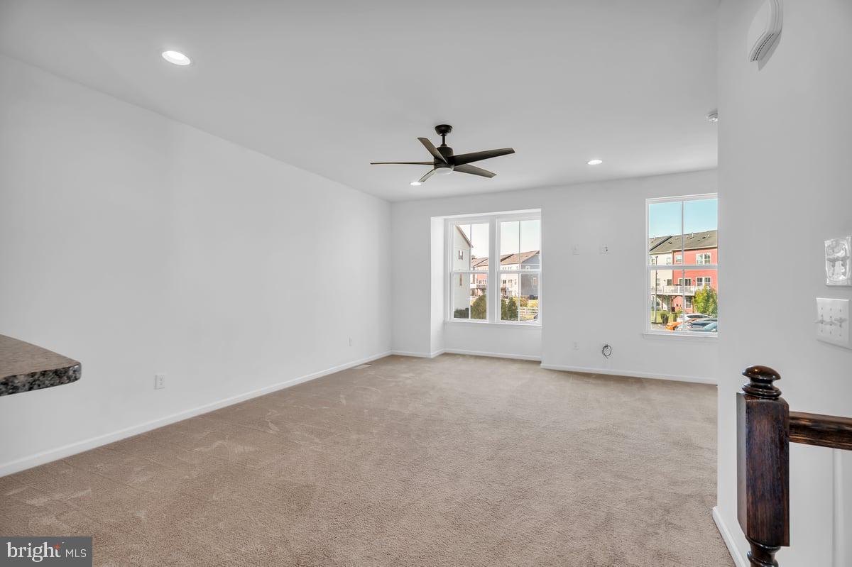 322 Iannelli Road Clarksboro, NJ 08020 - Photo 6 of 31 an empty room with windows and ceiling fan
