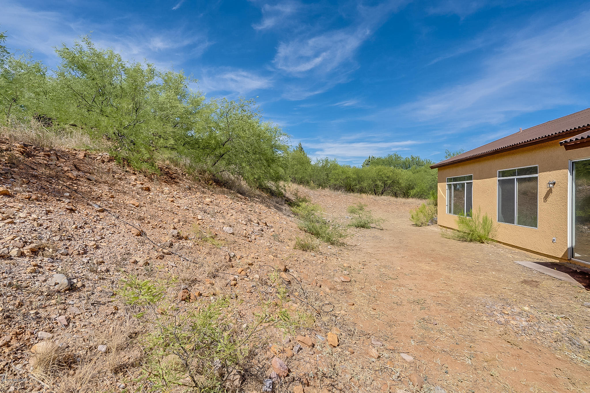 410 Wrightson Street Rio Rico, AZ 85648 - Photo 42 of 50 a view of a house with a yard