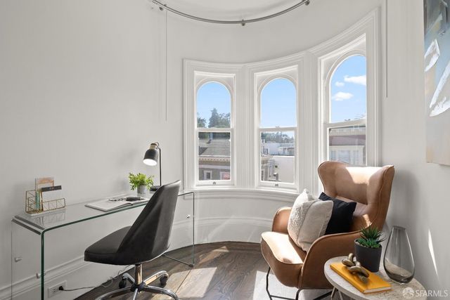 a front view of a residential apartment building with a yard