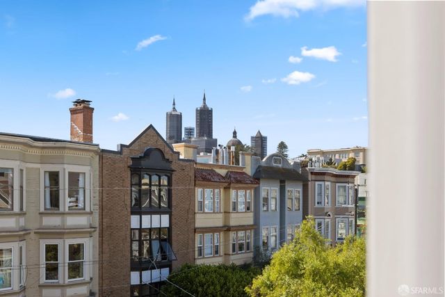 a bedroom with a bed and couch