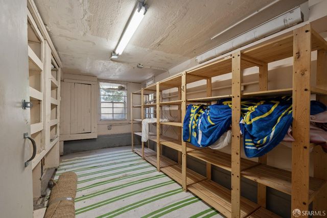 a view of a chairs and table in the back yard of the house