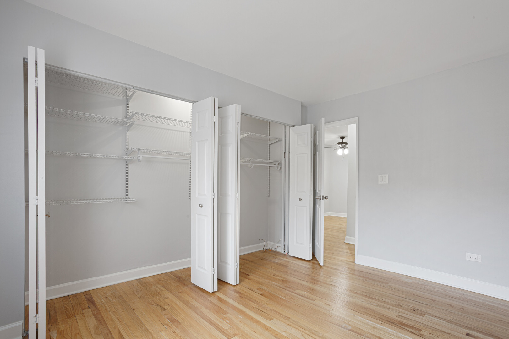 6758 North Sheridan Road, Unit 232 Chicago, IL 60626 - Photo 7 of 12 a view of an empty room with wooden floor