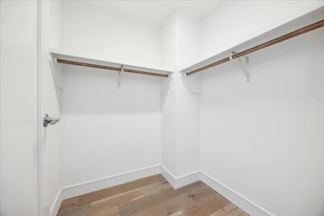 a living room with couches and a flat screen tv