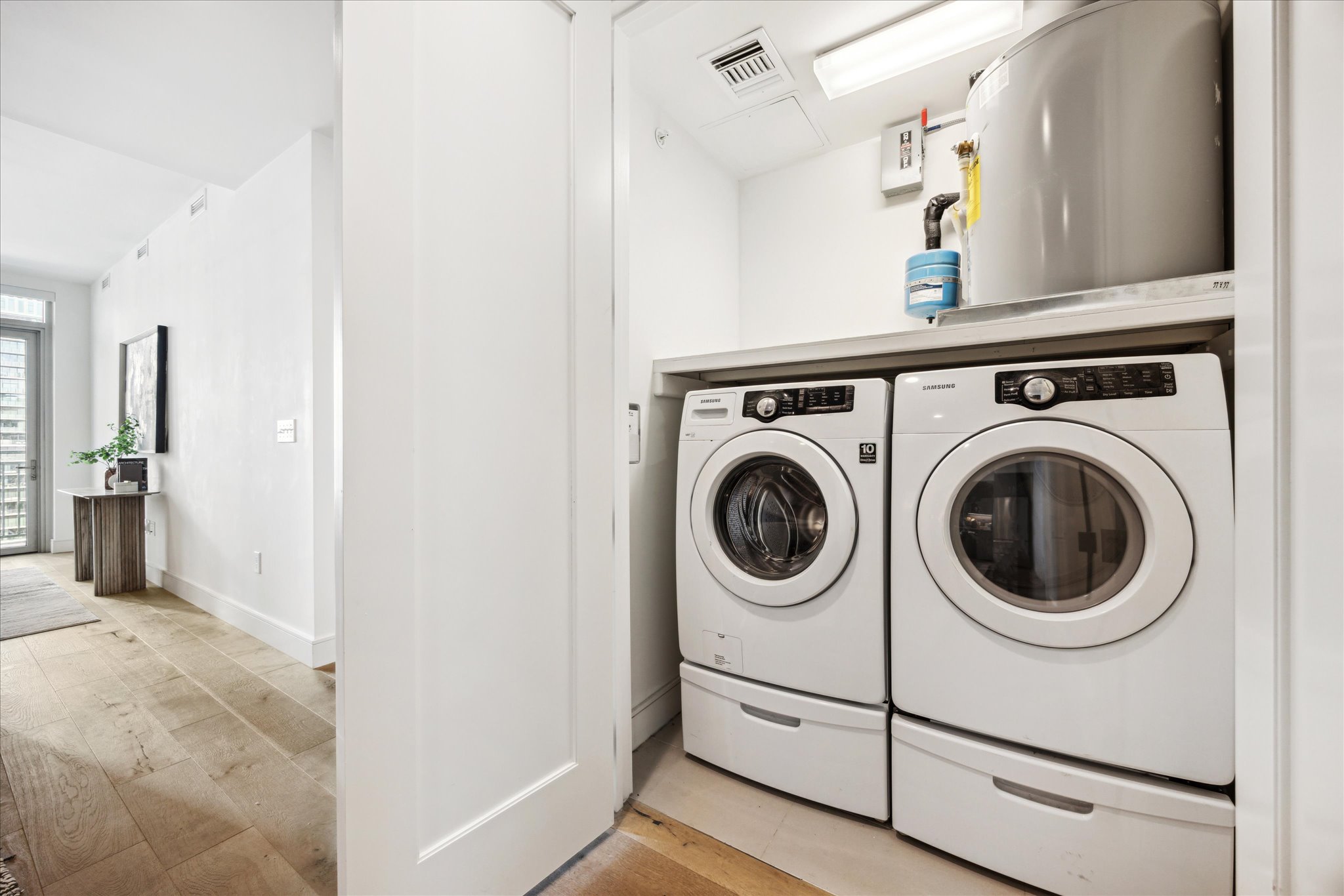 222 West Avenue, Unit 2403 Austin, TX 78701 - Photo 11 of 38 a view of a hallway with washer and dryer