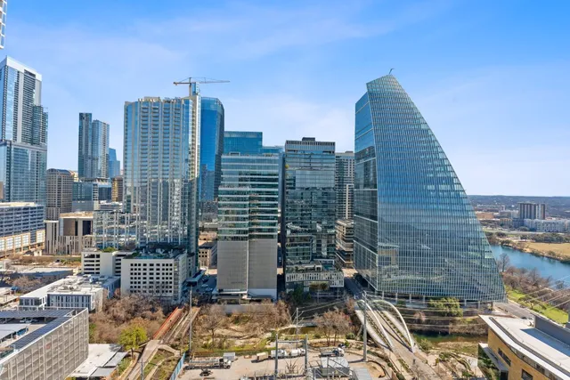 a view of a kitchen with stainless steel appliances and stove
