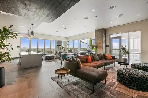 a living room with couches and a flat screen tv