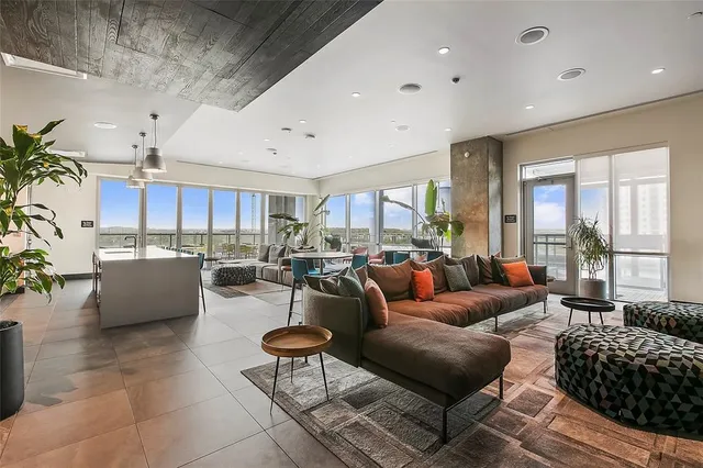 a view of a white building with a large window