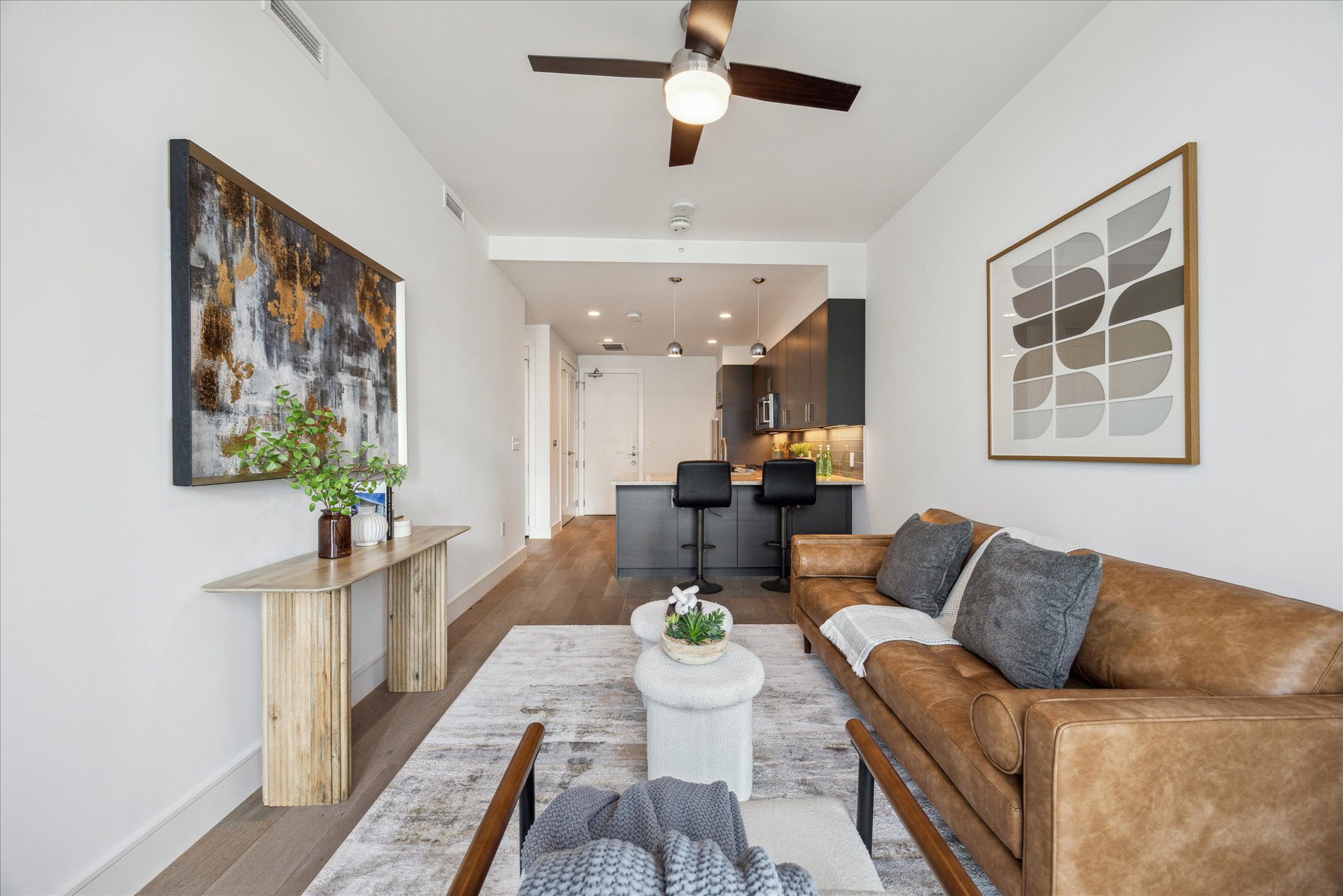 222 West Avenue, Unit 2403 Austin, TX 78701 - Photo 37 of 38 a living room with furniture and a table